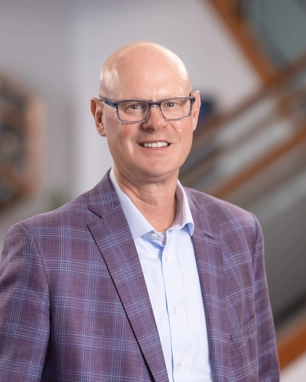 smiling person in professional attire
